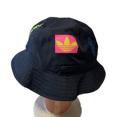 New With Tag Adidas Originals Bucket Hat. Black With All Over Different Logos. Fun And Bright Colors. Black Spring Bucket Hat, Black Bucket Hat For Spring Streetwear, Black Hats For Spring Streetwear, Trendy Black Bucket Hat For Streetwear, Urban Black Bucket Hat, Urban Black Bucket Hat With Curved Brim, Adidas Snapback, White Bucket Hat, Mens Hats Baseball