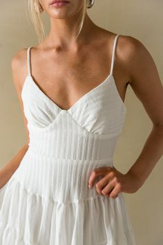 Fit for any mood, the Martina Ribbed Tie Back Mini Dress is the must-have sundress of the Summer! This fit and flare mini dress features a beachy ribbed texture, open tie back back detail, and bustier style bodice! Available in White, Green, and Black. Accessorize to complete the look! Details: 90% Polyester. 10% Spandex Lots of stretch Back zipper Back tie closure Adjustable straps Hand wash cold/ Line dry Fit And Flare Mini Dress, Open Back Mini Dress, Corset Bodice, Flare Mini Dress, Ribbed Texture, Green And Black, Tie Backs, Tie Back, Dream Wardrobe