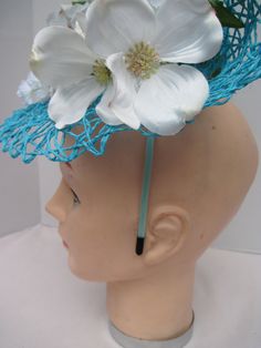 "* This design sits off to the right side of the head tilted and curved to give that sophisticated flair to the piece. * The hat form is 14\" in diameter with a light weight weave and designed with white silk Magnolia flowers. * It has an Asian feel and is appropriate for a Bridesmaid, Attending a wedding, wedding shower or baby shower. * It is light weight, balanced and comfortable to wear and upon ordering you will receive this exact fascinator. * Designed on a satin covered metal headband it Hat Form, Ladies Luncheon, Magnolia Flowers, Metal Headband, Wire Headband, White Magnolia, Metal Headbands, Magnolia Flower, Costume Hats