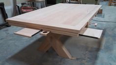 a wooden table being built in a shop