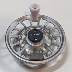 an image of a fly reel on a table