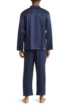 A classic button-up top pairs with matching bottoms in breathable silk pajamas that feel like a dream and can be cleaned in the washing machine. Top has front button closure; long sleeves; chest patch pocket Bottoms have elastic waist; side-seam pockets 100% silk Machine wash, dry flat Imported Blue Sleepwear With Button Closure For Loungewear, Blue Sleepwear With Button Closure, Silk Long Sleeve Bedtime Set, Casual Silk Sleepwear For Pajama Party, Silk Casual Sleepwear For Pajama Party, Silk Sleepwear For Pajama Party, Silk Long Sleeve Sleepwear For Home, Long Sleeve Sleepwear With Button Cuffs For Loungewear, Long Sleeve Sleepwear With Button Cuffs