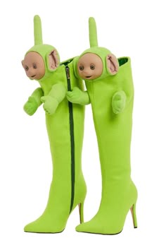 a pair of green boots with monkeys on them