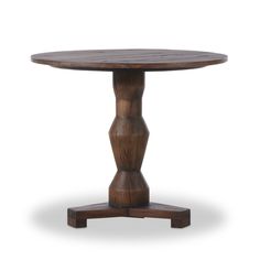 a round wooden table with two legs and a circular wood top, on an isolated white background