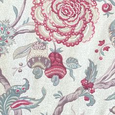 an old wallpaper with flowers and leaves on it's surface is shown in this close up photo