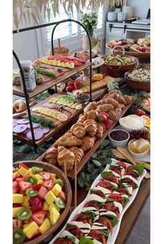 a buffet table filled with lots of different types of food