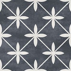 a black and white tile with flowers on it