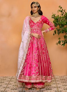 Our Pink Embroidered Anarkali Style Palazzo Suit includes a net top with satin inner, a net bottom with satin inner, and an organza dupatta. Embroidery is present on this style using zari and sequins embellishments. Like all of our pieces, this piece is made in India and checked by hand to ensure high quality. Anarkali Set With Resham Embroidery In Tissue Silk, Reception Art Silk Anarkali Set With Sheer Dupatta, Festive Anarkali Set With Intricate Embroidery, Navratri Embroidered Organza Gown, Tissue Silk Churidar For Diwali Reception, Reception Churidar With Sheer Dupatta In Tissue Silk, Navratri Organza Embroidered Gown, Embroidered Organza Gown For Navratri, Bollywood Style Raw Silk Anarkali Set For Reception