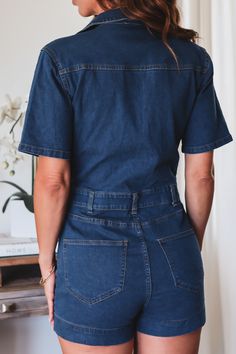 Take your denim wardrobe to the next level with The Jessie Romper! This transition-fabulous jumpsuit is the perfect pick for days when you're feeling a little bit wild, a little bit casual, and a little bit denim-y. 75% Cotton 22% Polyester 3% Spandex Color: Dark blue denim Deep V Romper No bust closure Button Zipper short closure Front & Back pockets Visible Stich seams Long 1/4 sleeve Shorts Style True to size Model is wearing a size Small. She is 5'6". 135lbs. Bust: 34C Waist 26" Hips 36 Zipper Shorts, Denim Romper, Blue Denim, Jumpsuit, Zipper, Rompers, Wardrobe, How To Wear, Color