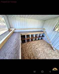 the inside of a shed with some wood in it