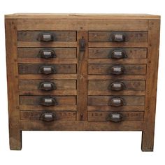 an old wooden dresser with metal knobs