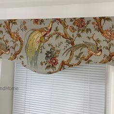 the window valance is decorated with birds and flowers