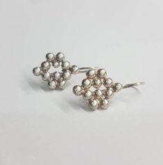 Elegant collection of pearly-like tiny metal bits designed as a bunch of grapes. These grape earrings were 100% handmade Dimensions: The bunch of grapes silver earrings are 0.5x0.4 inches (1.25x1 cm). Total drop length is 0.75 inch. These drop silver earrings are available both in 14k gold plating and sterling silver and are a perfect gift for her. great bridesmaids earrings or beautiful to wear everyday. To see other earrings I make: https://www.etsy.com/il-en/shop/EfratMakovJewelry?section_id= Grape Earrings, Woodland Earrings, Grape Bunch, Medallion Necklace, Cluster Earrings, Coin Necklace, Delicate Earrings, 925 Sterling Silver Earrings, Bridesmaid Earrings