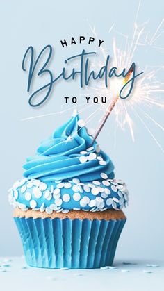 a cupcake with blue frosting and sparkler on top that says happy birthday to you