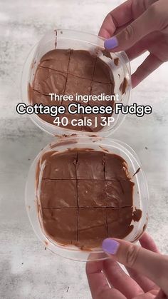 two hands holding slices of chocolate cheese fudge in plastic containers with text overlay that reads, three ingredients cottage cheese fudge 40 cals 1 p