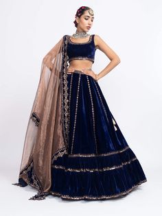 Editor's Note Navy Blue Without Sleeve Blouse Paired With Double Tier Lehenga And Tissue Dupatta Fabric: Velvet, Tissue Color: Blue Care: Dry Clean Only About the Designer Vvani by Vani Vats- a... Flowy Lehenga, Lengha Choli, Sleeve Blouse, Color Blue