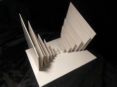 an open white box with folded papers inside