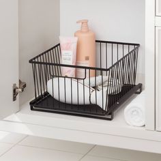 a bathroom shelf with soap and lotion in it