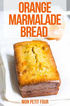 an orange marmalade bread on a white plate with text overlay that reads, mon petit four