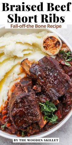 a bowl filled with beef short ribs and mashed potatoes