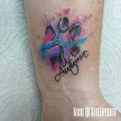 a person with a tattoo on their foot that says, i love you and paw prints