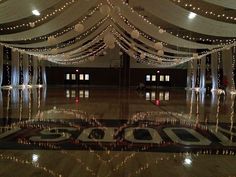 the dance floor is decorated with lights and decorations