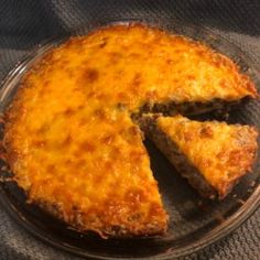 a cheesy cheese pie on a glass plate