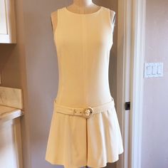 Prada Ivory Sleeveless Open-Back Belted Waist Dress Made In Italy Size 42 / Size 6 Us Dry Clean Only Bust 32" Waist 28" Hips 34" Fabric Unknown But Definitely Has Some Stretch To It. Classic Sleeveless Mini Dress For Daywear, Cream Sleeveless Fitted Mini Dress, Sleeveless Beige Mini Dress For Daywear, Beige Sleeveless Mini Dress For Daywear, Cream Sleeveless Mini Dress For Work, 60s Clothing, Prada Dresses, Waist Dress, Dress Making