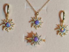 * Rapunzel Inspired Dream Sun Opal Necklace, Bracelet, Earring and Ring Set is High Quality 925 S. Silver and it does not tarnish.  * The Necklace and Ring are adjustable. Necklace is suitable for everyone. 40+5 cm extender. * Gemstone : Purple Opal * 14K Gold Vermeiled. * To prevent the color of your jewelry from fading; Care should be taken to avoid contact with external factors such as cream and alcohol. * Keeping your jewelry in a pouch or a box after using it will prolong the life of your jewelry. * You can do your product maintenance with a cotton-soft dry cloth. * You can keep it in the gift box sent together. * Full address, contact person, and phone number are required for the shipping. Your Jewelry will arrive pre-packaged in a genuine branded gift box. This 925 sterling silver j Dazzling 14k Gold Hallmarked Jewelry, Dazzling Sterling Silver Halo Jewelry, Celestial Jewelry With Matching Round Earrings, Dainty Hand Set Sterling Silver Jewelry, Hand Set Sterling Silver Jewelry Gift, Celestial Round Hallmarked Jewelry, Sterling Silver Jewelry Hand Set As Gift, Sterling Silver Halo Jewelry, Sterling Silver Halo Jewelry In Fine Style