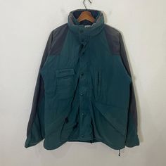 [DESCRIPTION] Please read the description first before buy my items‼️‼️ Vintage Columbia Sportswear Company Jacket (please refer the actual measurements given and compare it with best fitting clothes,by using the size on tag is not always accurate) All in good condition [MATERIAL] Cotton Polyester  [MEASUREMENT] Measurement:  armpit to armpit : 23 inches  Back collar to bottom : 28 inches Sleeve length from under armpit to end of cuff : 24 inches [CONDITION] - All in good condition  - have littl Winter Outdoor Fleece Jacket With Buttons, Winter Streetwear Outerwear With Snap Buttons, Sporty Long Sleeve Outerwear With Button Closure, Green Long Sleeve Track Jacket For Hiking, Green Outerwear With Snap Buttons For Streetwear, Winter Streetwear Windbreaker With Button Closure, Hooded Snap Button Outerwear For Streetwear, Outdoor Fleece Jacket With Buttons, Outdoor Long Sleeve Fleece Jacket With Buttons