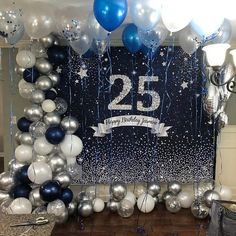 a birthday decoration with balloons and streamers in the shape of a number twenty five