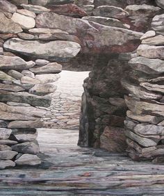 an image of a stone wall with rocks in the middle and one door opening to another