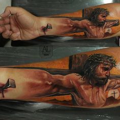 a man's arm with a cross and jesus on it