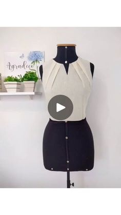 a dress on a mannequin is shown with the video showing how to sew