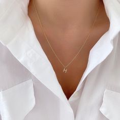 Personalize your necklace stack with our Dainty Initial Necklace. Perfect for stacking or wearing alone. These make a great gift to any of your loved ones. This necklace is made of stainless steel, so waterproof! The color remains perfect. Gold: 18k gold platingMaterial: Stainless steelLength: 45cmPendant Size: 10mmNeed a Longer Chain?Add up to 2.5" on any of our necklaces with our "Extender's" Waterproof jewelry Glazd Pouch with every order Free US shipping Easy Exchange & Return policy PRODUCT Trendy Hypoallergenic Necklaces As Gifts, Trendy Hypoallergenic Necklace As A Gift, Trendy Hypoallergenic Necklace Gift, Everyday Hypoallergenic Yellow Gold Necklace, Minimalist Initial Pendant Chain Necklace Gift, Minimalist 14k Gold Filled Initial Necklace Gift, Minimalist 14k Gold Hypoallergenic Necklace, Dainty Name Necklace With Clavicle Chain For Everyday, Dainty Everyday Name Necklace With Clavicle Chain