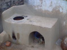 a cement oven with two holes in it