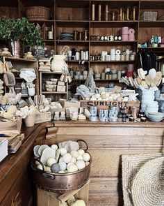 a room filled with lots of different types of pottery