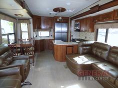 a living room and kitchen area in a recreational vehicle