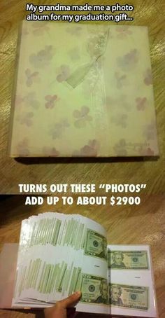 an open book sitting on top of a wooden table next to a pile of money