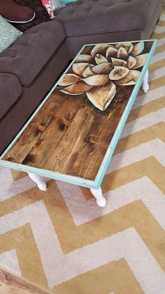 a coffee table sitting on top of a wooden floor