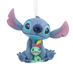 That lovable alien "dog" and a ragged, homemade doll may be small, and a little broken, but to Lilo they were always family. Celebrate your own ohana with this cute Christmas tree ornament of Stitch and Scrump. "Lilo & Stitch" fans will love to add these iconic characters to the holidays. Hallmark Ornaments are a great way to commemorate hobbies, life events and individual interests in entertainment, sports and more. Each festive and collectible ornament is perfect for sharing with family and friends. Disney Stitch With Scrump, Scrump Lilo And Stitch, Stitch And Scrump, Alien Dog, Lilo En Stitch, Disney Christmas Ornaments, Unicorn Ornaments, Lilo Y Stitch, Homemade Dolls