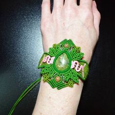 Introducing this beautiful Unakite Stone Macrame Cuff Bracelet, a stunning piece of handmade jewelry that embodies the essence of boho hippie style. Crafted with care, this bracelet showcases vibrant green and soft pink colors, perfectly complementing the natural beauty of the Unakite stone.  The centerpiece of this bracelet features an exquisite Unakite stone, characterized by its green hue with scattered pink spots, creating a unique and captivating pattern. The vibrant green and soft pink colors are thoughtfully incorporated into the macrame design, enhancing the bracelet's overall aesthetic appeal. Handcrafted with attention to detail, this cuff bracelet showcases an intricate macrame technique that adds depth and texture to the design. The adjustable cuff allows for a comfortable and Handmade Green Hippie Bracelets, Green Handmade Hippie Bracelets, Earthy Handmade Festival Bracelets, Green Macrame Jewelry For Festivals, Green Macrame Jewelry For Festival, Hippie Green Bracelet Jewelry, Handmade Green Hippie Braided Bracelets, Handmade Green Braided Hippie Bracelets, Handmade Earthy Braided Bracelet