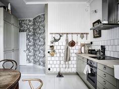 the kitchen is clean and ready for us to use it's tile backsplash