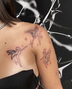 a woman with a tattoo on her shoulder