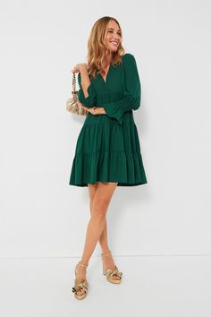 Meet one of our favorite silhouettes, the Crepe Kenzo Dress. Featuring feminine flutter smocked cuffs, a V-neckline, and a loose empire waist, this is the most flattering flirty frock! Pair this hunter green stunner with flats for a casual look or dress up with heels and statement earrings for date night. V-neckline Long sleeves Elasticated ruffle cuff Loose empire waist Tiered skirt Swing shape Mini length Crepe fabric Material: 97% Polyester, 3% Spandex Care: Machine wash cold Tuckernuck Dress, Kenzo Dress, Roxy Dress, Tier Skirt, Navy Blue Dresses, Crepe Fabric, Tiered Skirt, Hunter Green, Empire Waist