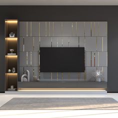 a living room with a large tv mounted on the wall and shelves in front of it