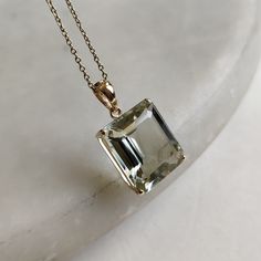 This stunning pendant is set in 14K Solid Yellow Gold with Natural Green Amethyst with utmost precision. It is an unique gemstone pendant for nearly every occasion and is completely hassle-free jewelry. ITEM DETAILS * Gem: Green Amethyst * Gem Size: 13X15mm * Gem Shape: Octagon * Gem Weight: 9.50 carats * Gold Purity: 14KT  * Gold Weight: 1.34 gram * Total Weight of the Pendant: 3.24 gram The Gold purity is guaranteed and it comes with authentic 14KT gold hallmark. Since my items are handmade, they are absolutely nickel and lead free. CUSTOMIZATION * Gemstone customization is available and it can be substituted with a gem of your choice. Kindly message me for the same. PACKAGING * The Pendant comes with layers of safe and secure wrapping along with Free handmade jewelry box with every purc Timeless Amethyst Jewelry Gift, Luxury Octagon Gemstones For Gifts, Faceted Gemstones In 14k Gold For Formal Occasions, Timeless Gold Jewelry With Amethyst, Timeless Gold Amethyst Jewelry, Luxury Green Amethyst Jewelry For Formal Occasions, Luxury Formal Jewelry With Green Amethyst, Luxury Green Amethyst Gemstone Jewelry, Elegant Faceted Green Amethyst Jewelry