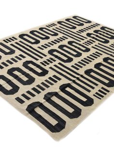 a black and white rug with numbers on the front, in different sizes and shapes