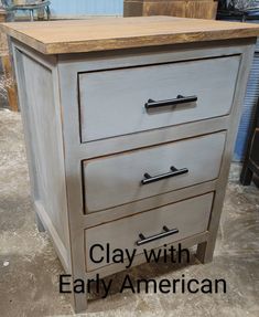 a close up of a drawer on a table with the words clay with early american