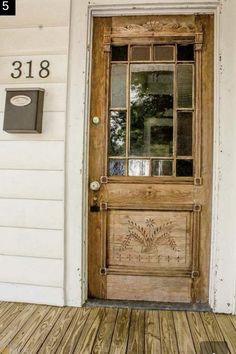 the front door to a house with a mailbox